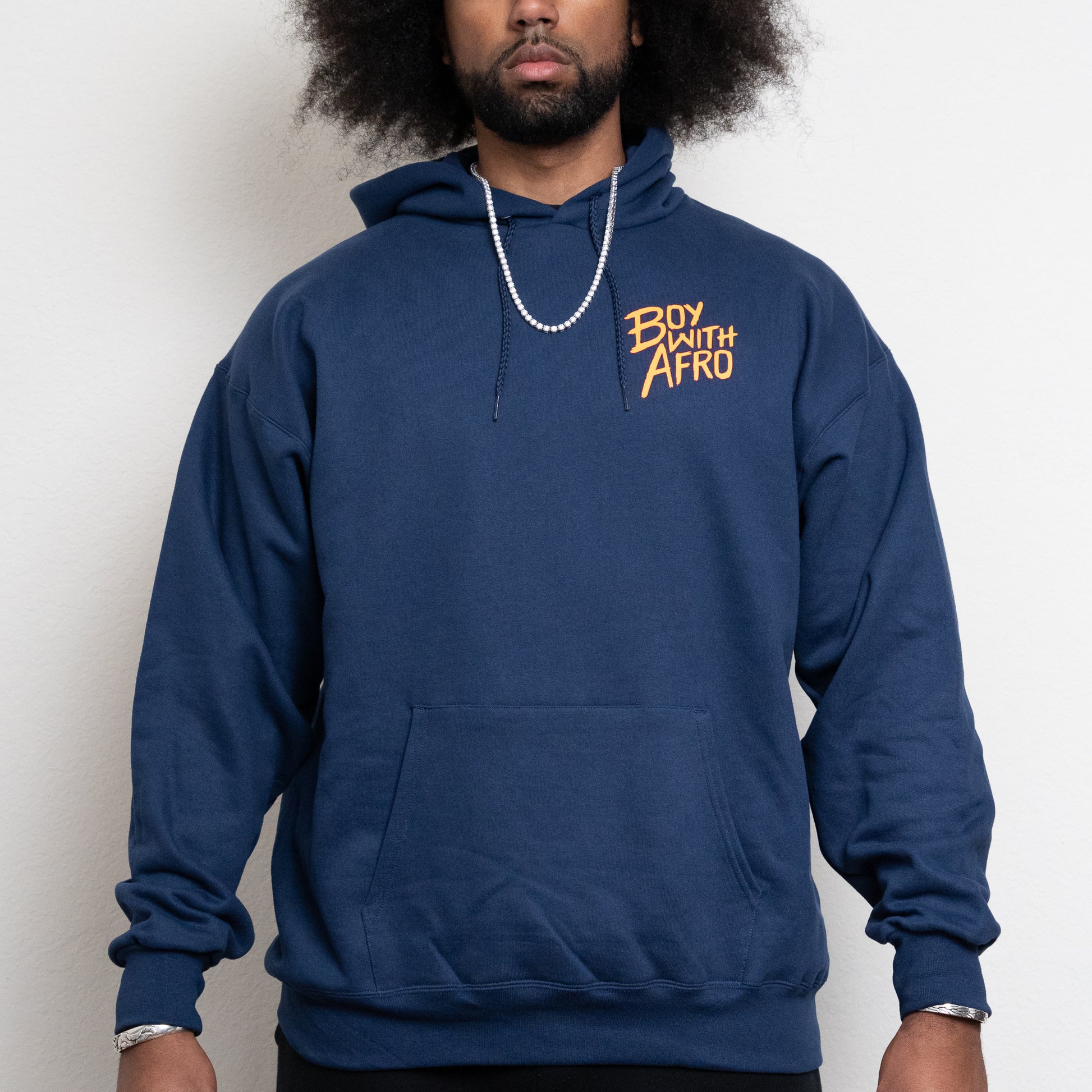 front-side of a navy hoodie with the BoyWithAfro logo on the upper left chest