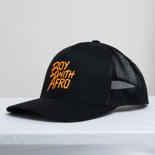 front view of a mid-profile hat with a mesh back and the BoyWithAfro logo on the front